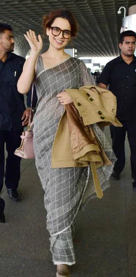 Kangana showcased her versatility in a sophisticated grey saree, paired with a chic pair of glasses. This look blended a touch of modernity with traditional charm, as she effortlessly balanced the two styles.